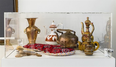 Display of various traditional Uyghur drink and food vessels