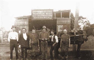 Black and white photo of men at Robson Bros. Blacksmiths circa 1917