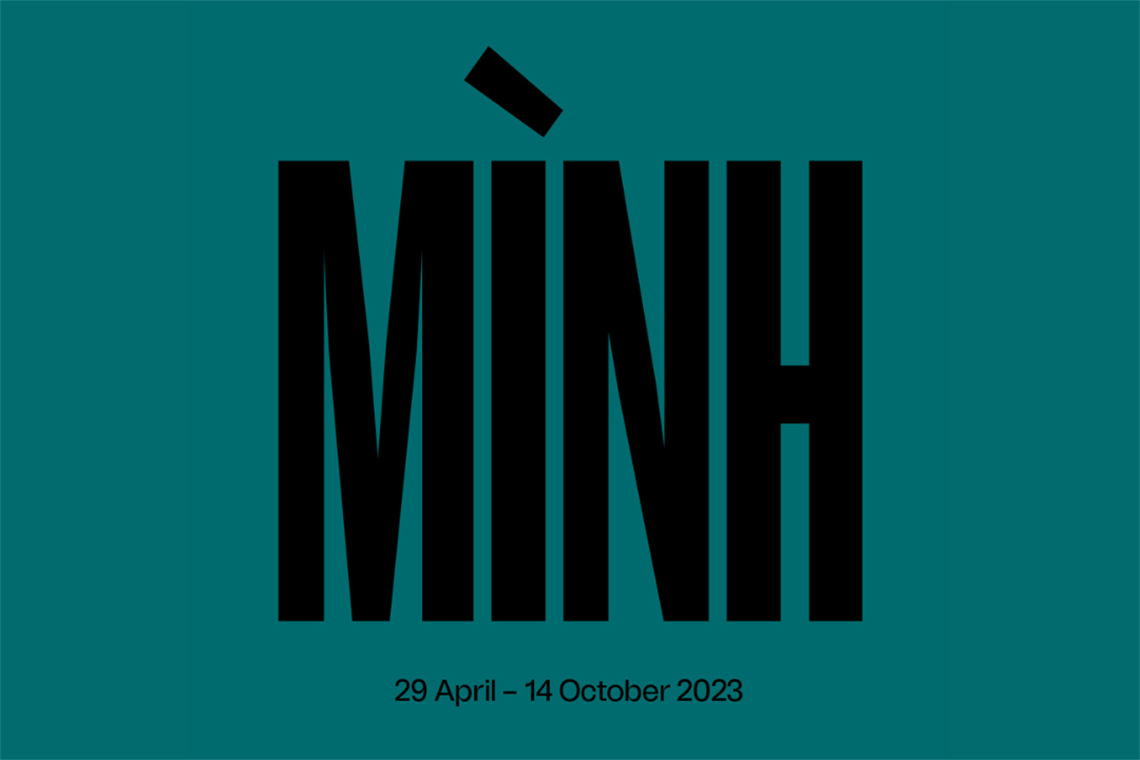 Graphic with MINH written in black text in front of a plain green background