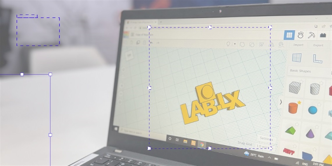 A laptop screen with a logo in a 3D design app