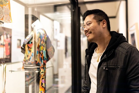 Young man viewing an art exhibition at FCMG