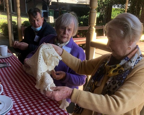Three seniors discussing doily over lunch at FCMG